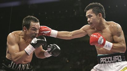 down three times by a more lively pacquiao however marquez